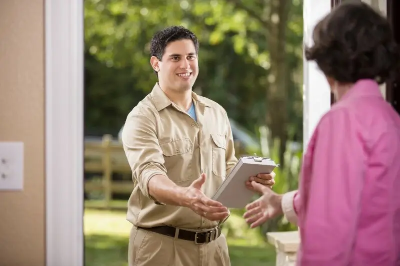 A friendly moving consultant explaining a quote to a client.