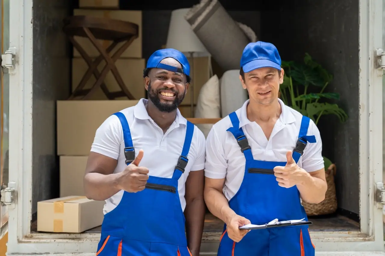 Two professional movers working together seamlessly as a team.