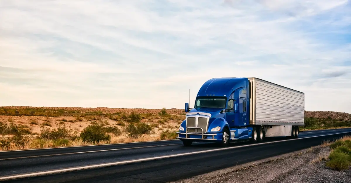 A moving truck on an open highway.