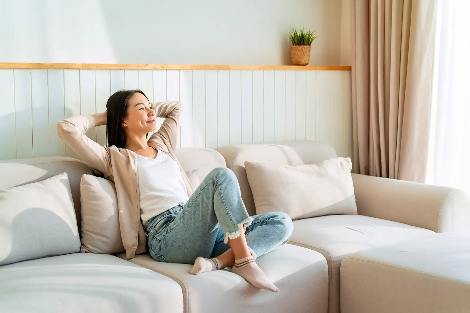 A happy person relaxing in their new home.