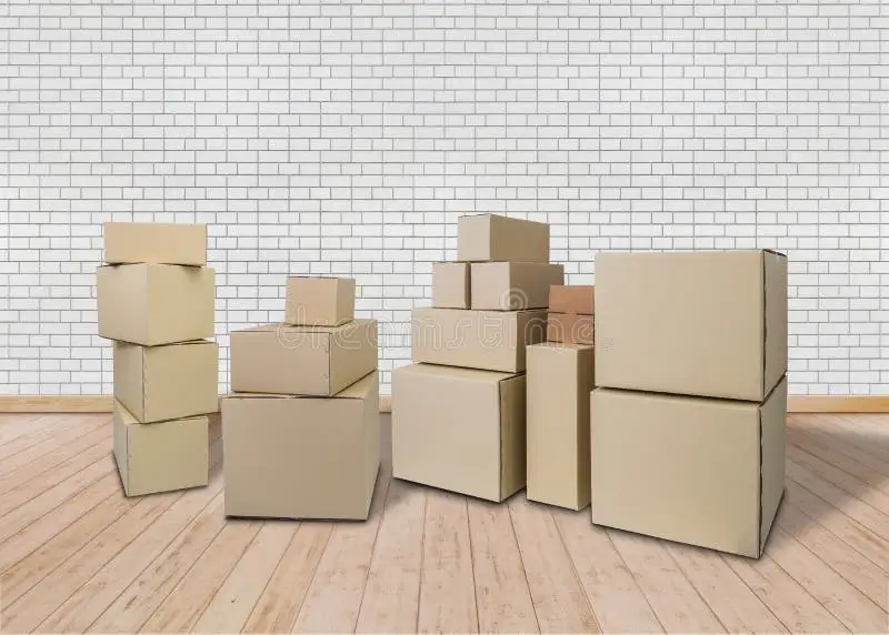 A neatly stacked pile of labeled moving boxes.